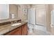 Traditional bathroom with granite vanity top, tub with shower and tile flooring at 1209 E Cumberland Ave # 2703, Tampa, FL 33602