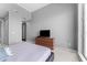 A well-lit bedroom showcases a patio and wooden dresser at 1209 E Cumberland Ave # 2703, Tampa, FL 33602