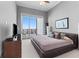 A modern main bedroom has a patio and contemporary furnishings at 1209 E Cumberland Ave # 2703, Tampa, FL 33602