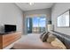 A modern main bedroom has a patio and contemporary furnishings at 1209 E Cumberland Ave # 2703, Tampa, FL 33602