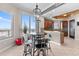 Modern dining area showcasing beautiful views, contemporary lighting and seamless flow into the kitchen at 1209 E Cumberland Ave # 2703, Tampa, FL 33602