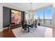 Modern dining room with hardwood floors, a glass table, and great lighting at 1209 E Cumberland Ave # 2703, Tampa, FL 33602