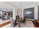 Chic dining room featuring hardwood floors, a modern chandelier, and water views at 1209 E Cumberland Ave # 2703, Tampa, FL 33602