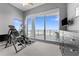 An exercise room with equipment and a balcony overlooking the city at 1209 E Cumberland Ave # 2703, Tampa, FL 33602
