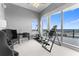 An exercise room with equipment and a balcony overlooking the city at 1209 E Cumberland Ave # 2703, Tampa, FL 33602