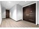 Hallway with hardwood floor and doors in neutral paint color scheme at 1209 E Cumberland Ave # 2703, Tampa, FL 33602