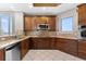 Well-equipped kitchen featuring stainless steel appliances, granite countertops and wood cabinetry at 1209 E Cumberland Ave # 2703, Tampa, FL 33602