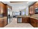 Open-concept kitchen with stainless steel appliances, granite countertops, and a seamless connection to the living area at 1209 E Cumberland Ave # 2703, Tampa, FL 33602