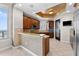 Modern kitchen featuring granite countertops, sleek backsplash and stainless steel appliances at 1209 E Cumberland Ave # 2703, Tampa, FL 33602