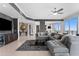 Stylish living room with tile floors, sleek furniture, and a built-in bar at 1209 E Cumberland Ave # 2703, Tampa, FL 33602