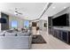 Contemporary living room featuring tile floors, a modern ceiling fan, and expansive windows with beautiful views at 1209 E Cumberland Ave # 2703, Tampa, FL 33602