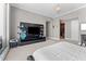 Modern main bedroom featuring a minimalist aesthetic, city views and seamless access to a private balcony at 1209 E Cumberland Ave # 2703, Tampa, FL 33602