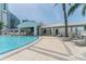 Relaxing pool area featuring a bar, lounge chairs, and convenient access for condo residents at 1209 E Cumberland Ave # 2703, Tampa, FL 33602