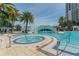 Luxury condominium pool with jacuzzi and waterfall feature, located next to an upscale condo building at 1209 E Cumberland Ave # 2703, Tampa, FL 33602