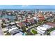 Fantastic location! Aerial view of homes with pools and canals near the beach and intercoastal waterway at 131 Forest Hills Dr, Redington Shores, FL 33708