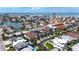 Aerial view of homes with pools and canals near the beach and intercoastal waterway at 131 Forest Hills Dr, Redington Shores, FL 33708