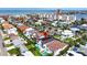 Elegant waterfront home featuring a luxurious pool, manicured backyard, and serene bay views at 131 Forest Hills Dr, Redington Shores, FL 33708