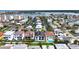 Scenic aerial view showcases waterfront homes along a canal with mature landscaping and a swimming pool at 131 Forest Hills Dr, Redington Shores, FL 33708