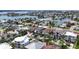 Beautiful aerial view of waterfront homes, mature palm trees, and a scenic canal neighborhood at 131 Forest Hills Dr, Redington Shores, FL 33708
