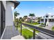 Balcony overlooking a beautiful street with manicured lawns and well-maintained homes at 131 Forest Hills Dr, Redington Shores, FL 33708