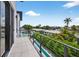 Balcony view showcasing city scenery and lush landscaping at 131 Forest Hills Dr, Redington Shores, FL 33708
