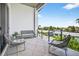Spacious balcony with comfortable seating and scenic views at 131 Forest Hills Dr, Redington Shores, FL 33708