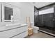 Modern bathroom featuring a sleek vanity, a glass-enclosed shower, and minimalist design at 131 Forest Hills Dr, Redington Shores, FL 33708