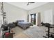 Well-lit bedroom with modern furnishings, a neutral palette, and a view of the neighborhood at 131 Forest Hills Dr, Redington Shores, FL 33708