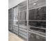 Modern closet with sliding glass doors showcasing clothing and storage solutions at 131 Forest Hills Dr, Redington Shores, FL 33708