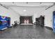 Spacious garage featuring a hockey net and an area for ping pong at 131 Forest Hills Dr, Redington Shores, FL 33708