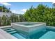 Beautiful in-ground hot tub surrounded by lush greenery and serene ambiance at 131 Forest Hills Dr, Redington Shores, FL 33708