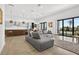 Open living space combining kitchen, dining, and living areas with plenty of natural light at 131 Forest Hills Dr, Redington Shores, FL 33708