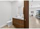 Stylish powder room with modern vanity, lighted mirror, and designer accents at 131 Forest Hills Dr, Redington Shores, FL 33708