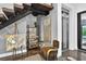 Unique staircase showcasing a modern chair, art easel, and elevator for added convenience at 131 Forest Hills Dr, Redington Shores, FL 33708