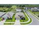 A high angle view of a home with well-maintained yard in a suburban setting, showcasing its neighborhood at 13304 Mylion Way, Spring Hill, FL 34610