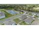 Aerial view showcasing the home's location within a residential community, nearby pond, and serene surroundings at 13304 Mylion Way, Spring Hill, FL 34610