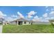 Expansive backyard featuring a well-maintained lawn and fence, perfect for outdoor activities and relaxation at 13304 Mylion Way, Spring Hill, FL 34610