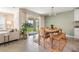 Dining area with natural light, tile flooring, and casual furnishings at 13304 Mylion Way, Spring Hill, FL 34610
