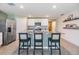 Kitchen island featuring granite countertop, stainless steel appliances, and ample counter space at 13304 Mylion Way, Spring Hill, FL 34610