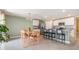 Eat-in kitchen with island seating, stainless appliances, and tile floors at 13304 Mylion Way, Spring Hill, FL 34610
