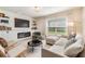 Comfortable living room with fireplace, built-in shelving, and neutral color scheme at 13304 Mylion Way, Spring Hill, FL 34610