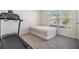 Bright spare bedroom featuring a carpet floor and a window offering ample natural light at 13304 Mylion Way, Spring Hill, FL 34610
