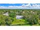 View of the property surrounded by mature trees in a quiet neighborhood at 134 Barrington Dr, Brandon, FL 33511
