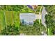 Aerial view of the home showing the pool, lawn, and driveway at 134 Barrington Dr, Brandon, FL 33511