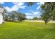 Large grassy backyard surrounded by a tall fence offering privacy at 134 Barrington Dr, Brandon, FL 33511