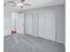 Comfortable bedroom featuring neutral tones, ceiling fan, and closet storage space at 134 Barrington Dr, Brandon, FL 33511