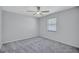 Cozy bedroom with carpet floors, neutral colors, a window and ceiling fan at 134 Barrington Dr, Brandon, FL 33511