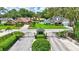 View of the community entrance gate with well-manicured landscaping at 134 Barrington Dr, Brandon, FL 33511
