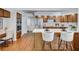 Bright open kitchen with stainless steel refrigerator, breakfast bar and wood cabinets at 134 Barrington Dr, Brandon, FL 33511