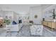 Bright living room featuring neutral paint, high ceilings, and stylish furnishings over plush carpeting at 134 Barrington Dr, Brandon, FL 33511